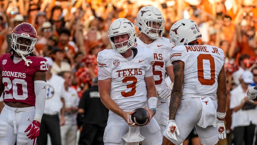 Quinn Ewers celebrates a TD with his Texas teammates.