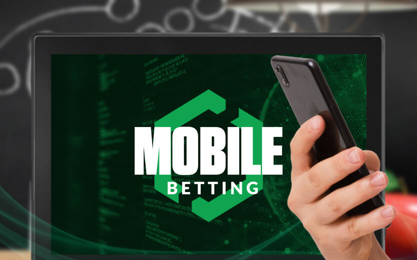 mobile betting text overlay on laptop and smartphone