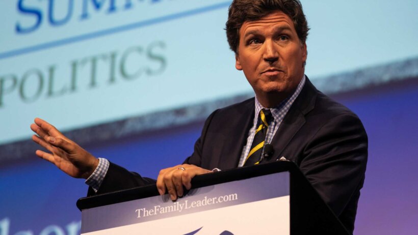 Tucker Carlson at a speaking engagement