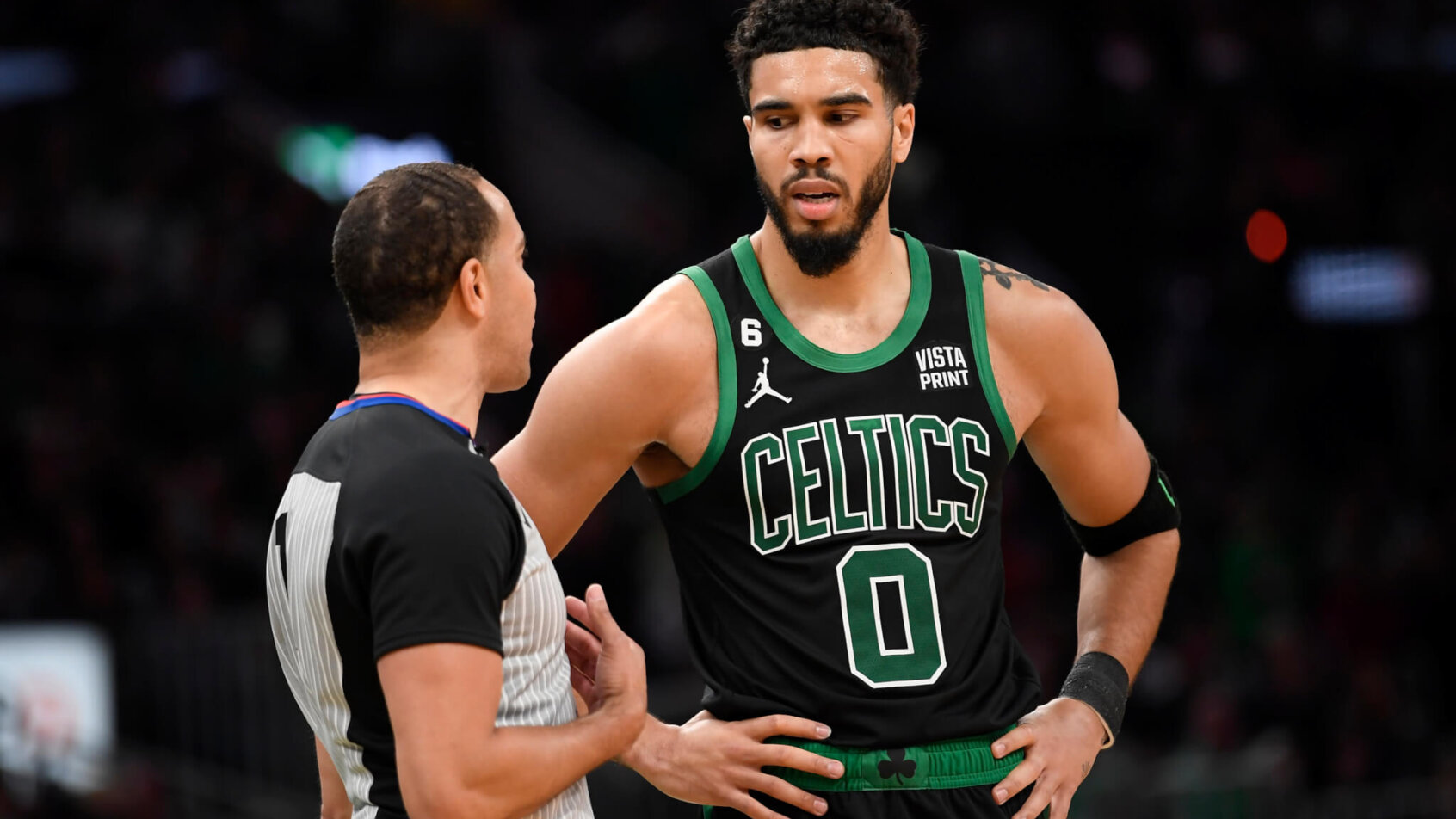 Boston Celtics forward Jayson Tatum talking to a ref