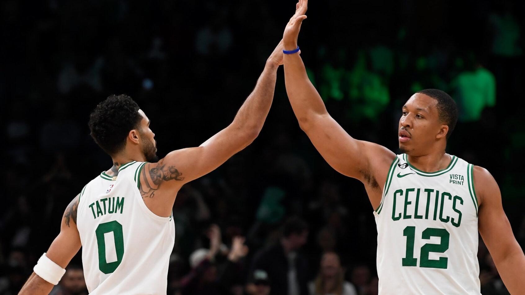 Boston Celtics forward Grant Williams high fives forward Jayson Tatum