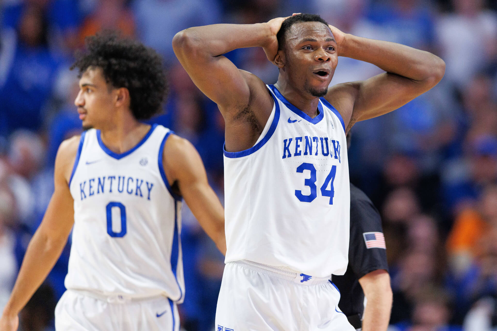 Kentucky Wildcats forward Oscar Tshiebwe with his hands on his head