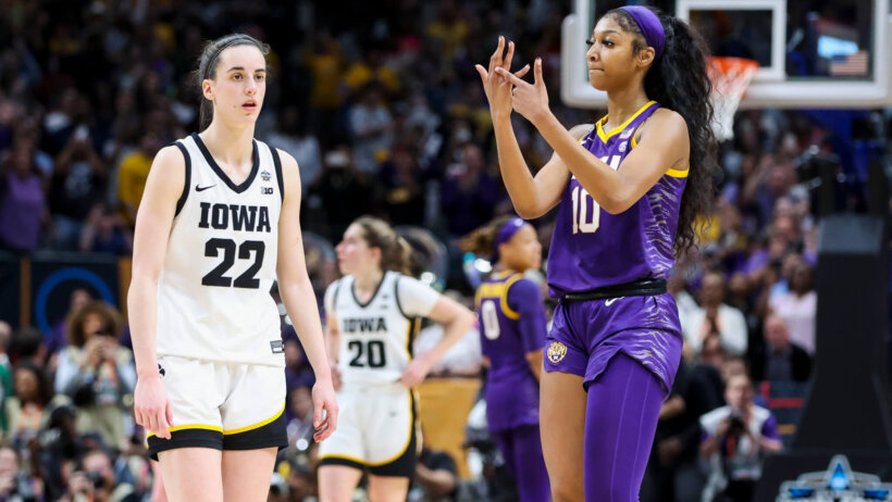 LSU Lady Tigers forward Angel Reese gestures towards Iowa Hawkeyes guard Caitlin Clark