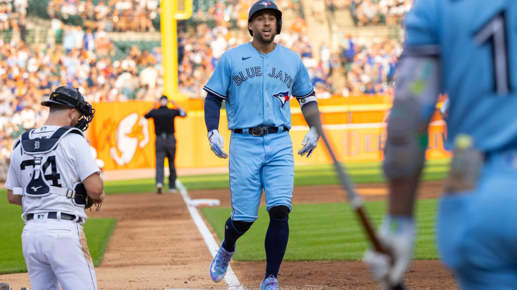 George Springer crossing home plate after hitting home run