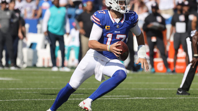 Josh Allen of the Buffalo Bills runs with football.