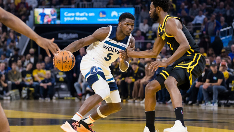 Minnesota Timberwolves guard Anthony Edwards drives against Golden State Warriors guard Brandin Podziemsk