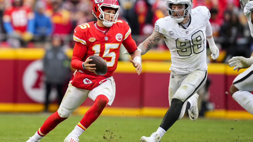 Kansas City Chiefs quarterback Patrick Mahomes (15) scrambles against Las Vegas Raiders defensive end Maxx Crosby