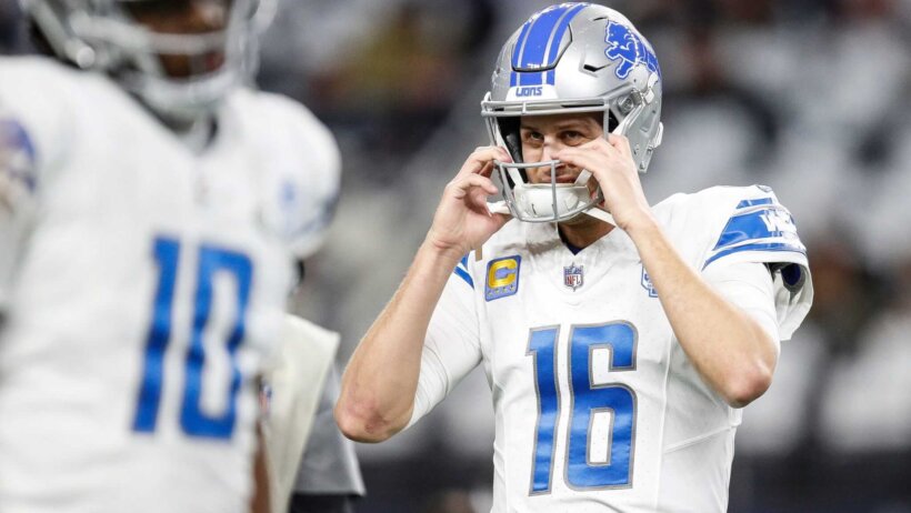 Detroit Lions QB Jared Goff grabbing helmet face mask white jersey