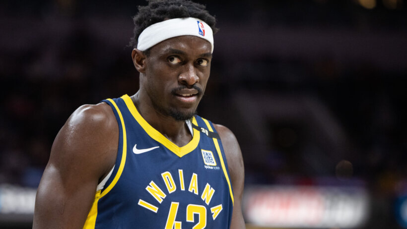 Pascal Siakam on basketball court blue jersey white headband