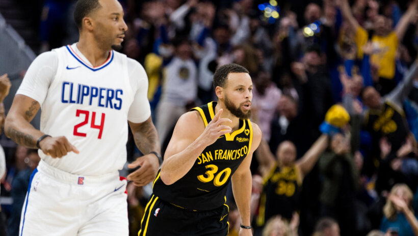 Golden State Warriors guard Stephen Curry pointing