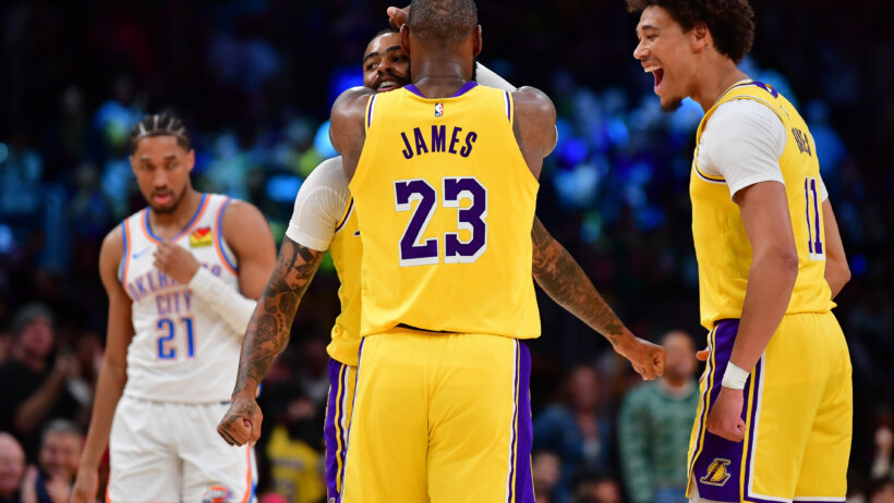 Los Angeles Lakers forward LeBron James hugging guard D'Angelo Russell