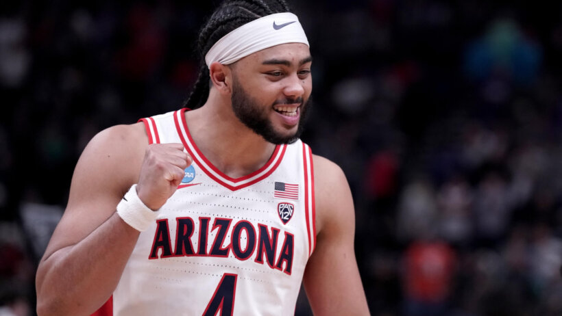 Arizona Wildcats guard Kylan Boswell fist-pumping after a basket