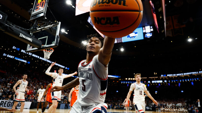 Connecticut Huskies guard Stephon Castle reaches for a loose ball