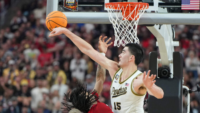 Purdue Boilermakers center Zach Edey blocks a shot from North Carolina State Wolfpack guard Jayden Taylor