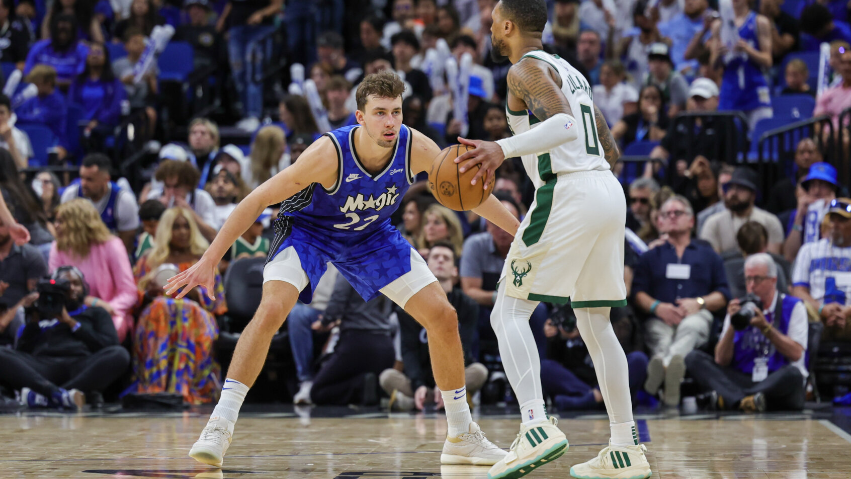 Orlando Magic forward Franz Wagner guarding Milwaukee Bucks guard Damian Lillard