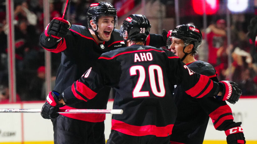 Carolina Hurricanes defenseman Brady Skjei celebrates his game-winning goal with teammates against the New York Rangers