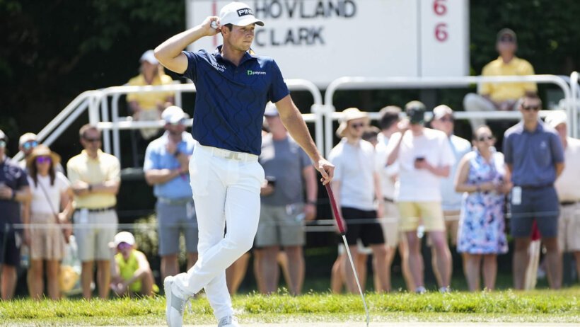 Viktor Hovland waiting to putt on the eighth hole at Muirfield