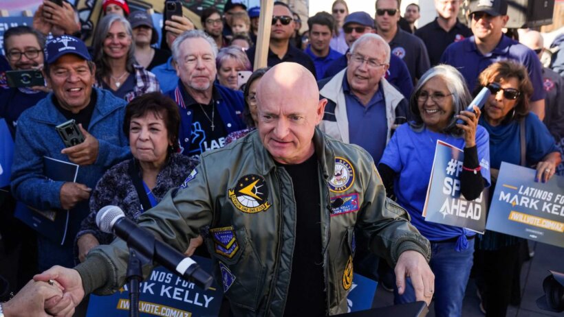 Sen. Mark Kelly shaking hands with supporters