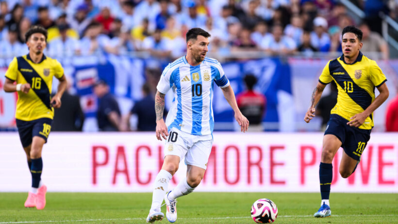 Argentina forward Lionel Messi dribbles the ball against Ecuador