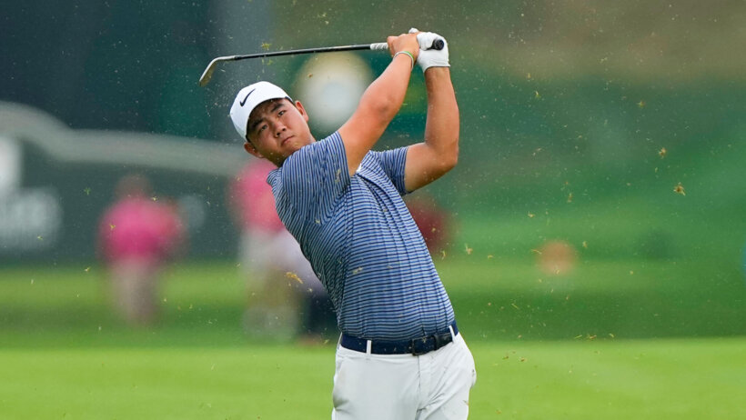 Tom Kim takes a shot during the playoff on the 18th hole of the Travelers Championship.