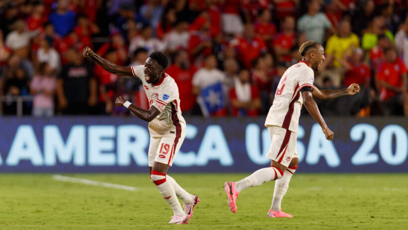 Canada defenders Alphonso Davies and Derek Cornelius celebrate a goal