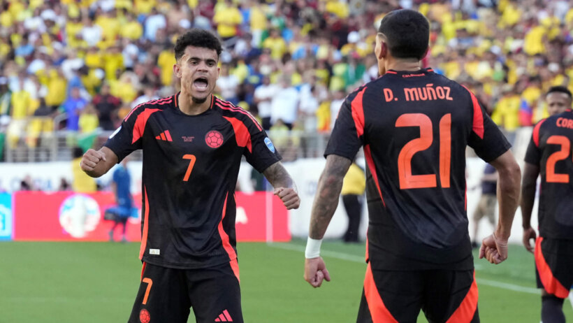 Colombia defender Daniel Munoz is congratulated by forward Luis Diaz