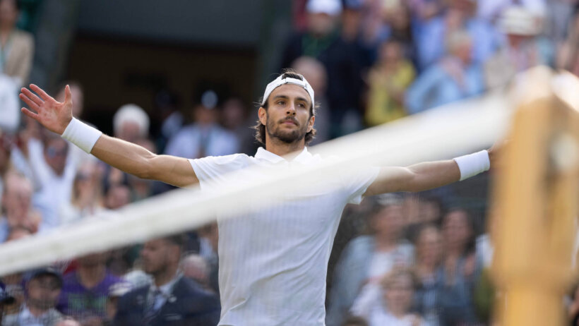 Lorenzo Musetti celebrates a win over Taylor Fritz at Wimbledon 2024