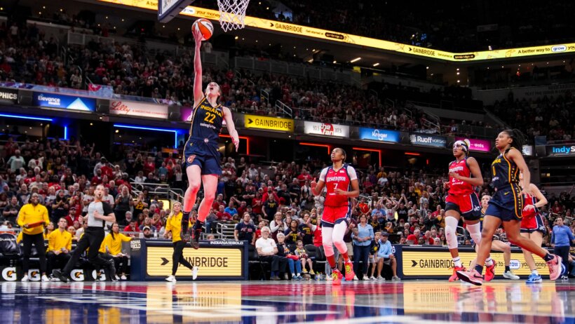 Indiana Fever guard Caitlin Clark scoring a layup