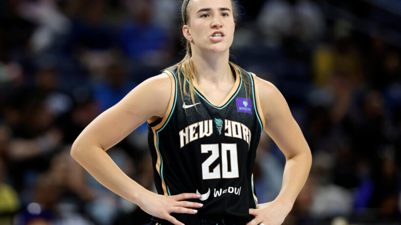 New York Liberty guard Sabrina Ionescu stands with hands on hips