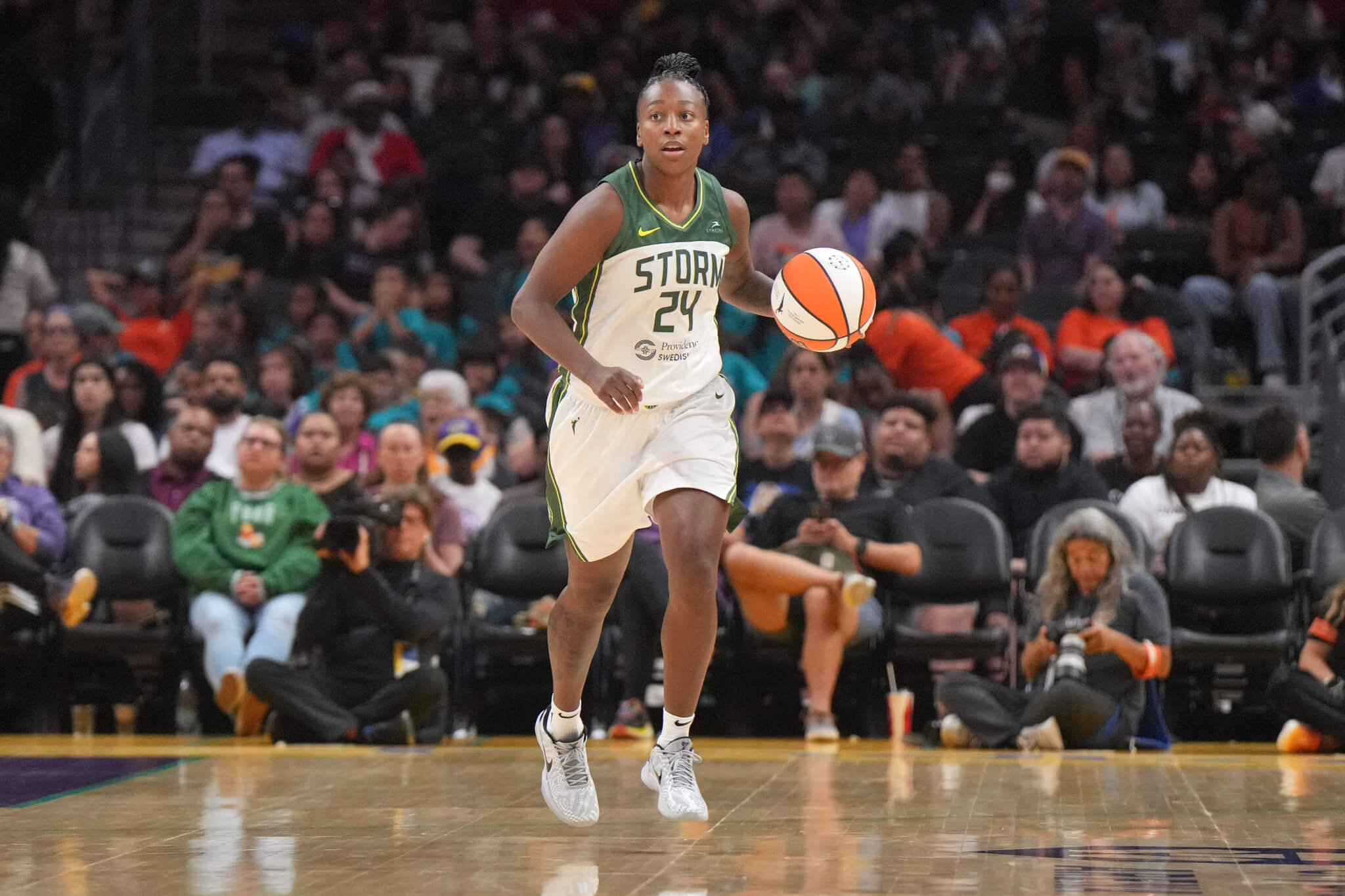 Seattle Storm guard Jewell Loyd dribbles the ball up the court