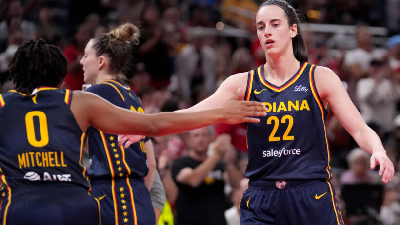 Indiana Fever guard Caitlin Clark and guard Kelsey Mitchell celebrate