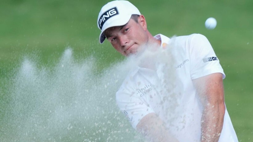 Viktor Hovland takes a shot from the sand trap on the 18th hole of the FedEx St. Jude Championship in 2024.