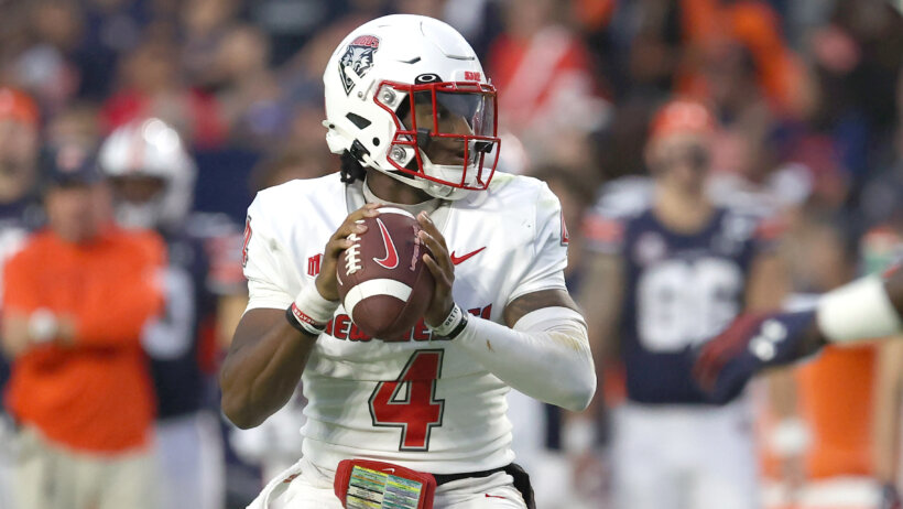 New Mexico quarterback Devon Dampier drops back to pass