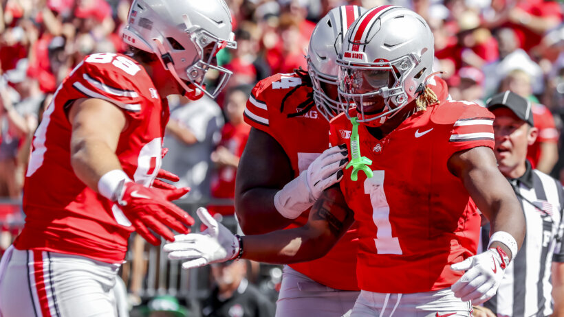 Ohio State Buckeyes football players celebrating.