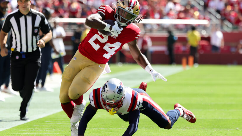 Jordan Mason running with football