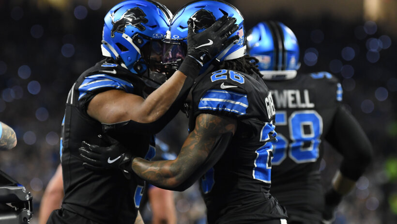 David Montgomery and Jahmyr Gibbs celebrating after a touchdown