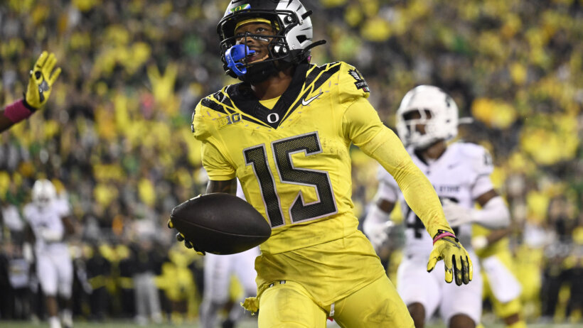 Oregon wide receiver Tez Johnson scoring a touchdown