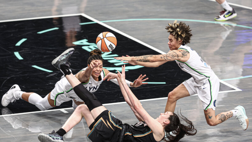 Minnesota Lynx forward Napheesa Collier fights for the ball with with New York Liberty forward Breanna Stewart