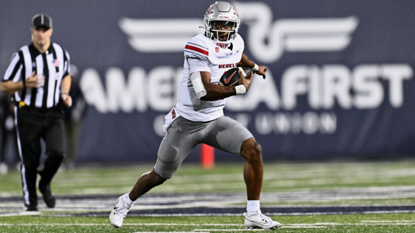 Hajj-Malik Williams rushes the ball against Utah State.