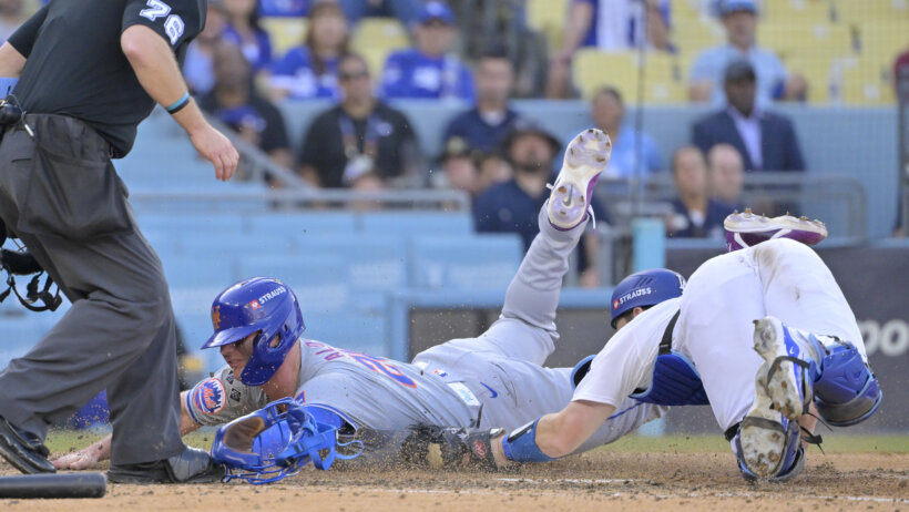 New York Mets first baseman Pete Alonso sliding into home