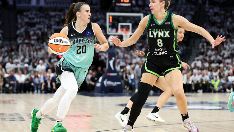 New York Liberty guard Sabrina Ionescu tries to drive around Minnesota Lynx forward Alanna Smith