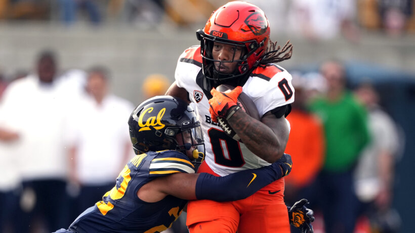 Anthony Hankerson tackled by a Cal defender.