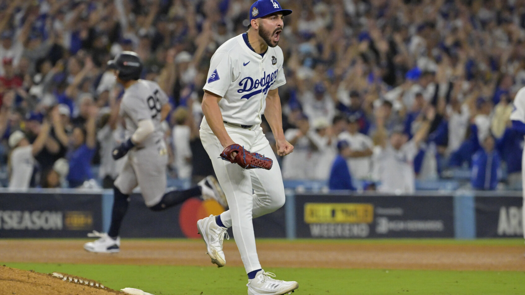 Los Angeles Dodgers pitcher Alex Vesia celebrates recording the final out against the New York Yankees