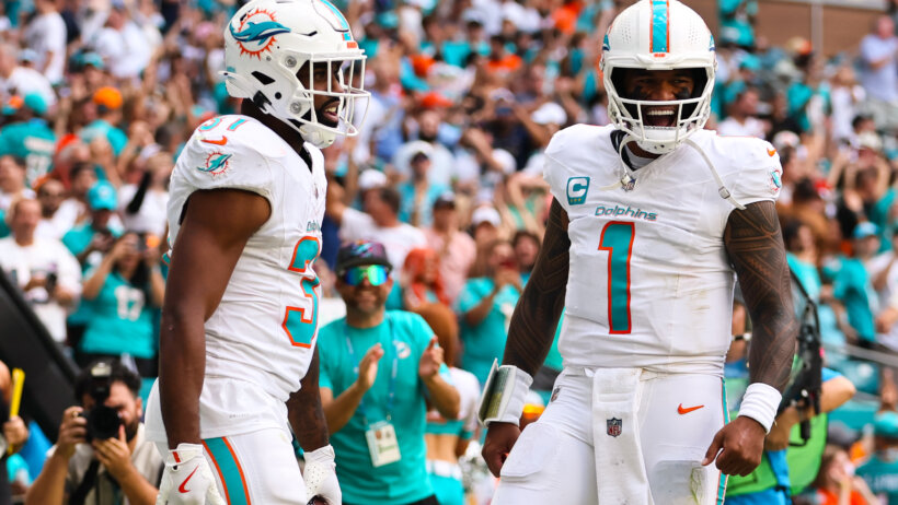 Miami Dolphins quarterback Tua Tagovailoa and running back Raheem Mostert celebrate a TD