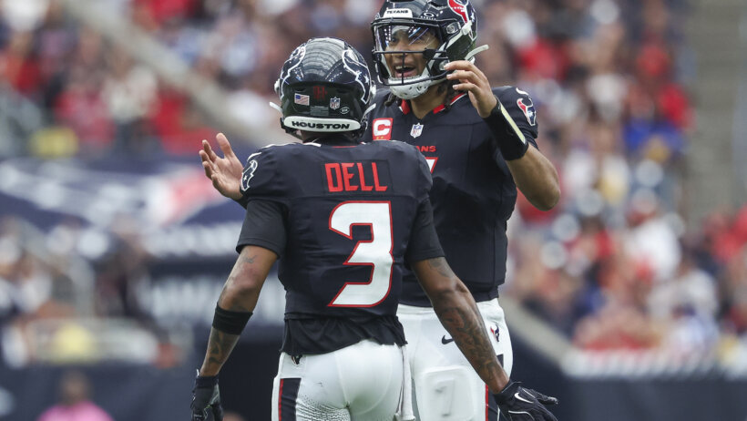 Houston Texans quarterback C.J. Stroud and wide receiver Tank Dell congratulating each other