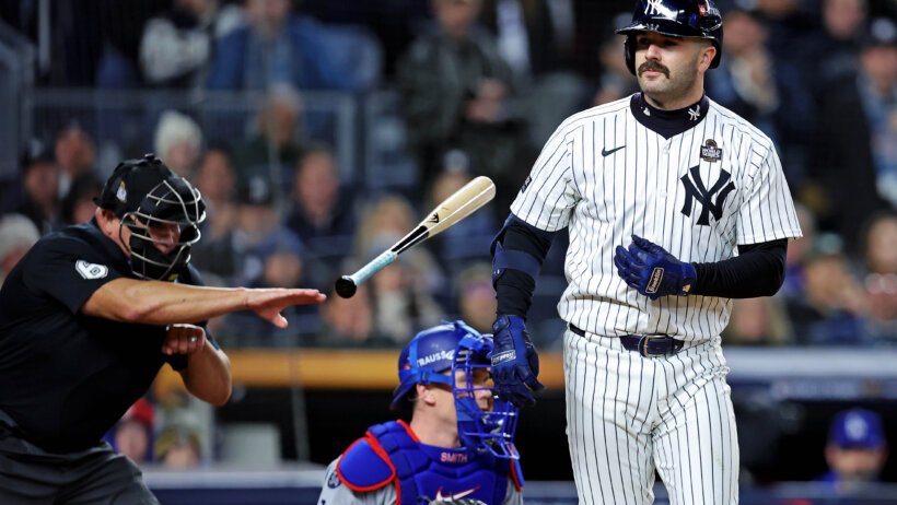 New York Yankees catcher Austin Wells tosses his bat after striking out