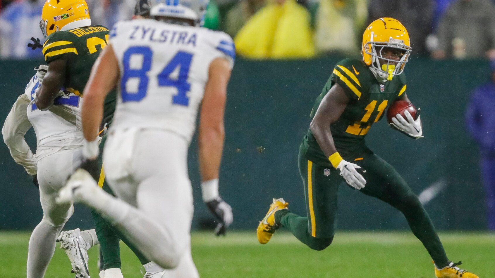 Green Bay Packers wide receiver Jayden Reed running with the ball against the Detroit Lions