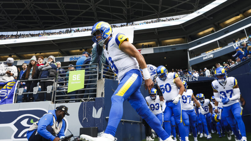 Matthew Stafford leads the Rams onto the field.