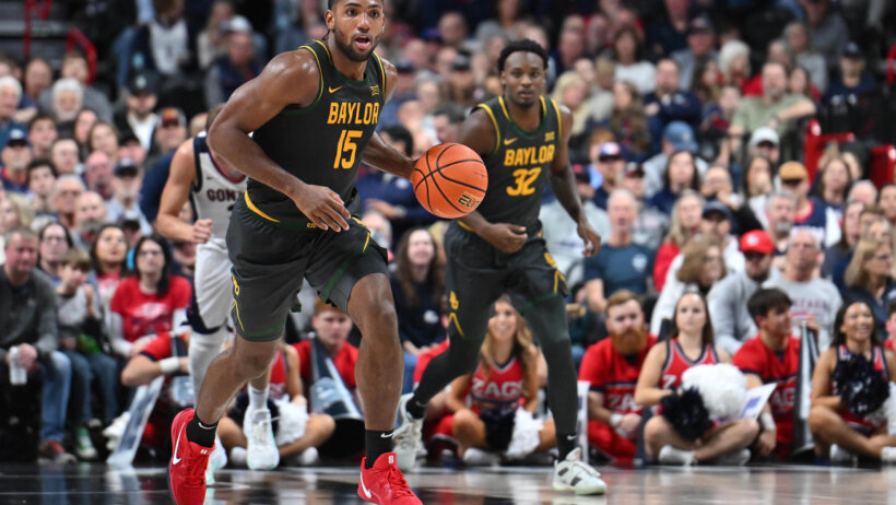 Baylor Bears forward Norchad Omier dribbling up the court