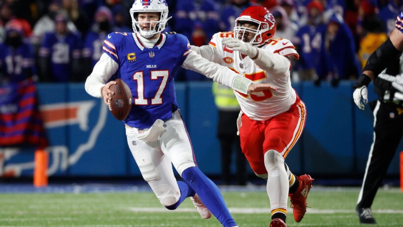 Buffalo Bills QB Josh Allen running with the ball while Kansas City Chiefs DL Chris Jones tries to chase him down